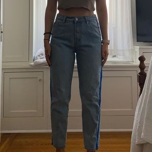 Light wash jeans with royal blue velvet stripe on the sides, from Adika